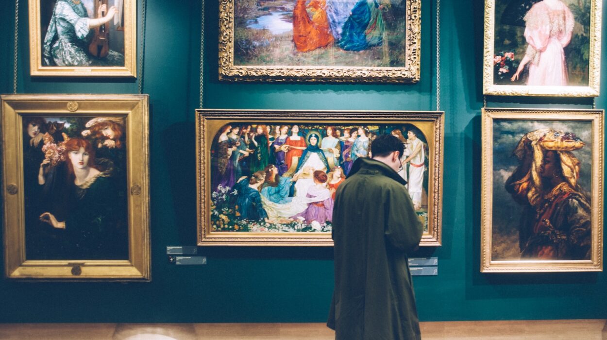 person standing near six paintings inside gallery